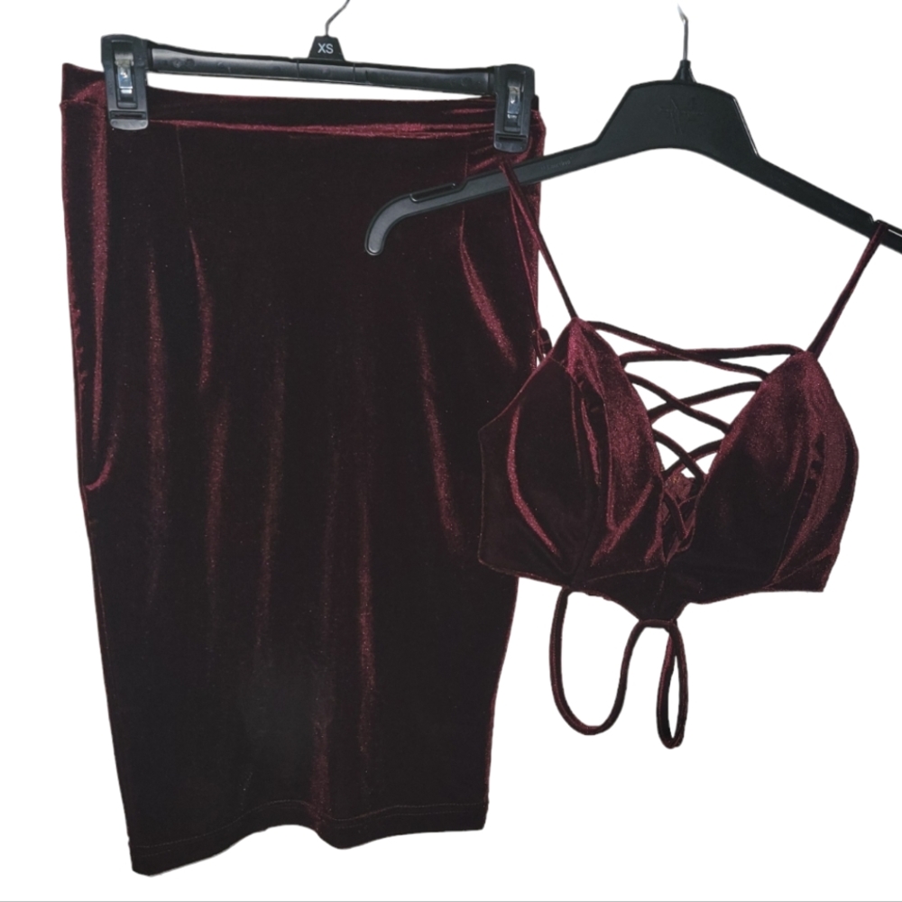 Small Maroon Shimmer skirt, criss cross design on the bottom, in the back.